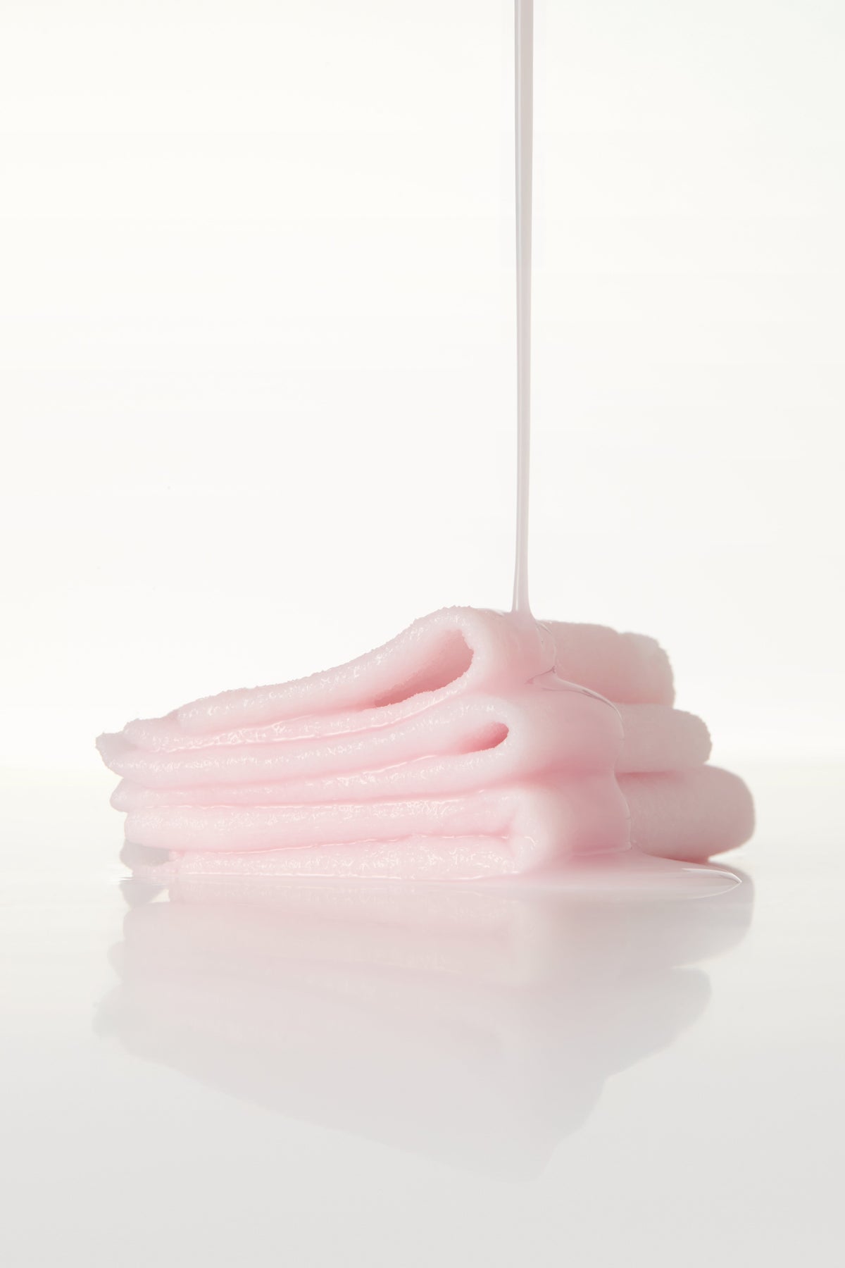 Pink cream folding into soft layers
